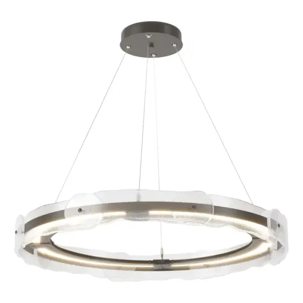 A graceful surround of hand-poured art glass entices you to contemplate the beauty of this pendant. Each of the textured glass panels is unique — handmade by the Vermont-based artisans at AO Glass.