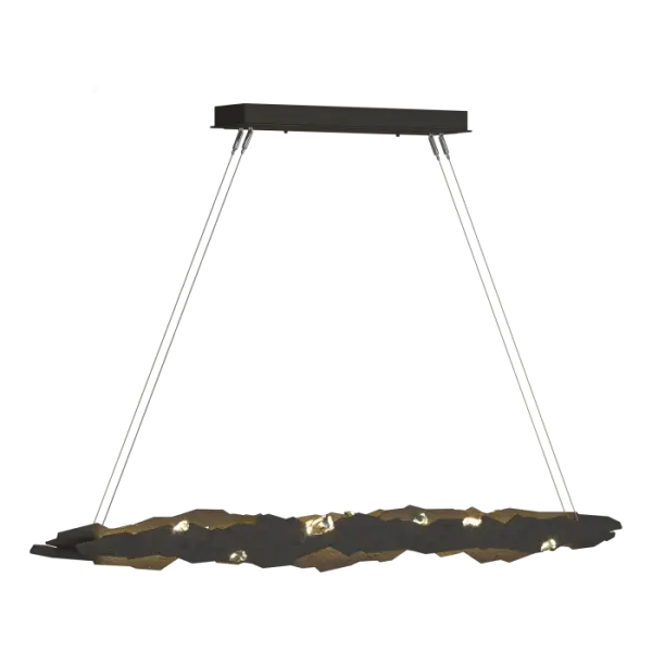 Both visually rich and dramatic, the Trove pendant interchanges points of jeweled light and planes of textured steel. Inspired by crystal in raw form, the featured crystals resemble treasures found deep in their mountains of steel.