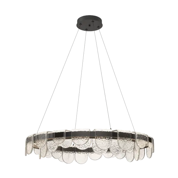 A riverbed of light. Stunning heavily-textured, clear poured artisanal glass in varying sizes are formed and shaped, then positioned on a round LED light-guide platform to stunning visual effect. Inspired by the cold icy streams of Vermont, adorned with ice-covered rocks and boulders, designer Andy Morter envisioned the Riverbed Collection to be like the frozen stones set along the river’s edge.