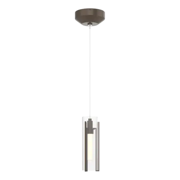 A single Exos Mini Pendant suspends a tall shade, in either opal or clear glass, that is nestled within three handmade, vertical steel arms from a small round canopy above with adjustable length low voltage cable. Available in all standard finishes.