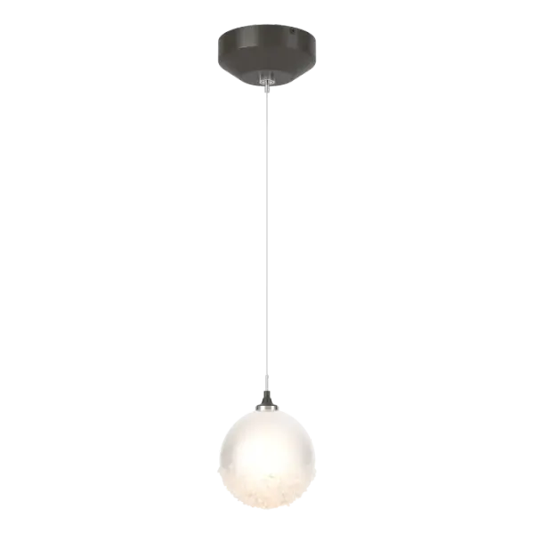 A single, low-voltage pendant that oozes femininity. The Fritz Globe 1-Light Mini Pendant features a graceful glass sphere that is etched on the inside, for a subtly diffused light, with a heavily-textured bottom of the outer glossy surface that is achieved with fritted glass for dramatic effect. Something so lovely and delicate makes a big statement.