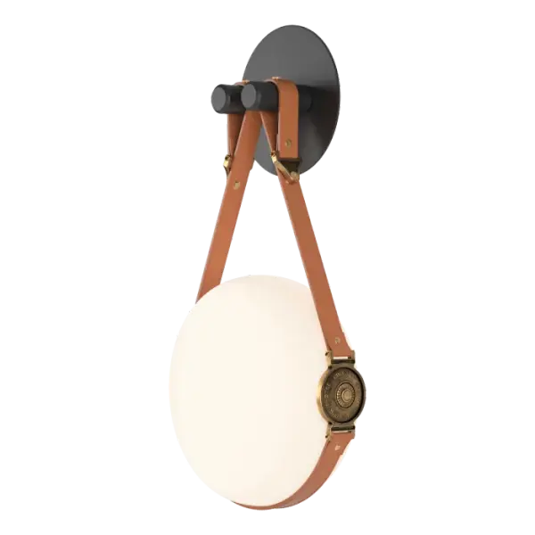 Unique and stylish, the Derby Sconce is part of the new Derby Collection, featuring handcrafted leather straps from a Vermont artisan, and brass fittings marked by the maker with Hubbardton Forge's insignia, proof of the quality craftsmanship. With a circular glass, flat to perfectly accommodate wall-hanging, the Derby Sconce is a stunning addition to any space. Leather is offered in a choice of British Brown or Chestnut.