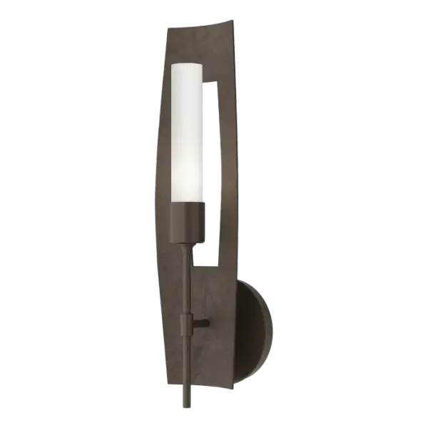 The elegance and craftsmanship of the Passage 1-Light Sconce is evident at first glance. Hand-forged, the texture of the curved backplate with its vertical cut-out creates a stunning play of light and shadow, much like Designer Jason Hancock’s original inspiration of light “cast through the frame of an open window.” Offered in a choice of clear or frosted glass and any of 11 standard finishes to customize the final look and style for its environment.