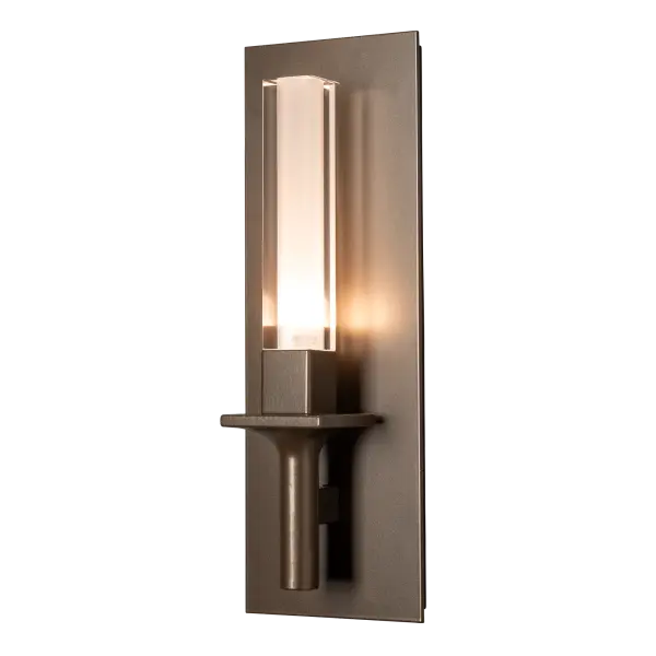 This classic single torch wall sconce has a twist. Take a look at the glass. A tall rectangular outer glass, offered in a choice of either clear or a plated smoke mirror-look, encases a frosted inner cylinder that diffuses the light within. Available in any of our standard interior finishes. - alternate view