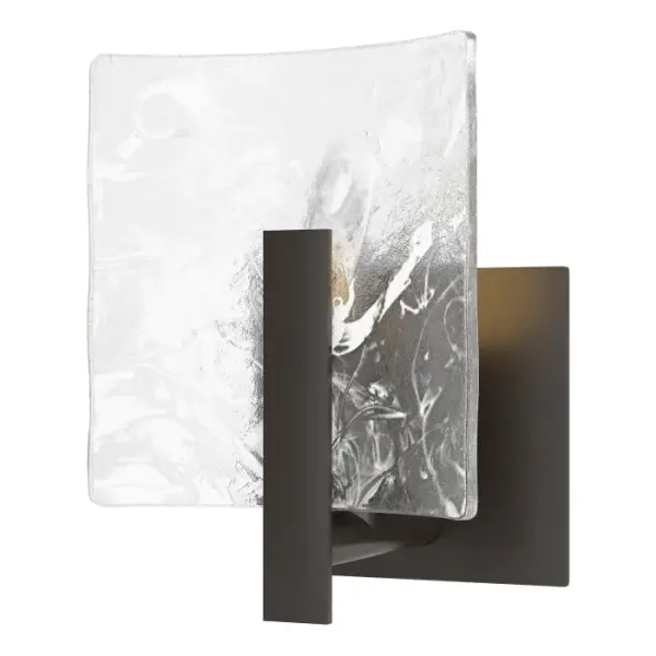 This Arc Bath Sconce features a smaller vertical rectangular glass with the Arc Collection's trademark abstract white swirls embedded in its thick, clear glass, secured by a handcrafted steel arm.