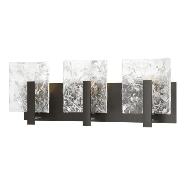 The Arc 3-Light Bath Sconce is the perfect to place above a mirror in a stylish single or double vanity bath environment. Featuring 3 of the Arc Collection's trademark thick convex panels of clear glass with embedded white freeform swirls.