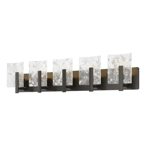 With five convex panels of thick clear glass with abstract white swirls within, the Arc 5-Light Bath Sconce is a linear wall mount ideal above a large vanity for the functional lighting required in a bath environment.