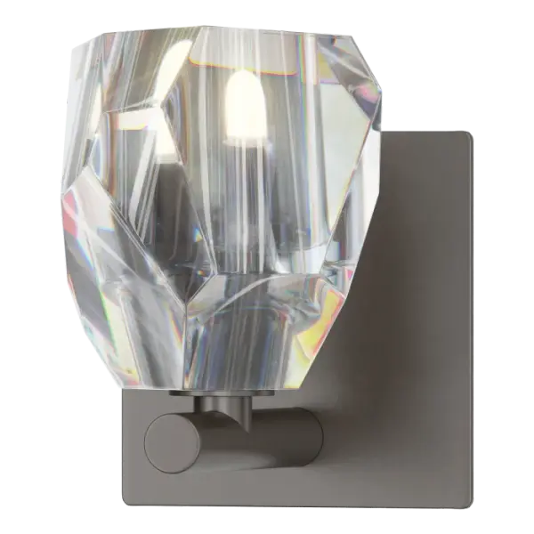 Single wall sconces are an elegant way to light the bath environment. Hand-cut and polished crystal is centered on a steel backplate, secured on a small outcropping of metal below. Available in Black, Oil Rubbed Bronze, Vintage Platinum, Soft Gold, Sterling and Modern Brass.