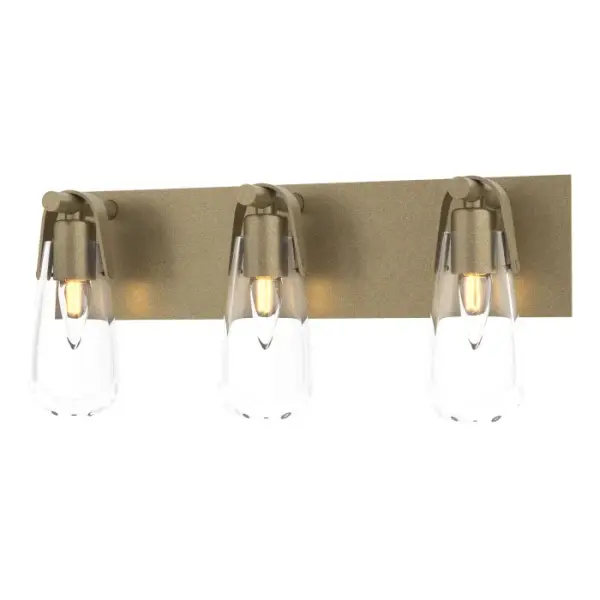 The Eos 3-Light Bath Sconce is named for its namesake glass, reminiscent of an early morning dewdrop left by Eos, the Greek goddess of dawn. Ideally suited to be placed above the mirror of single or double bath vanities. U-shaped metal bands and backplate are handcrafted by Vermont artisans
