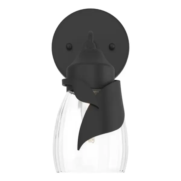 Able to be positioned for up- or downlight, the Lapas 1-Light Bath Sconce features a large and a small stylized leaf that embrace the glass shade. A single metal arm is angled from its small round backplate. Available in Black, Oil Rubbed Bronze, Vintage Platinum, Soft Gold, Sterling and Modern Brass.