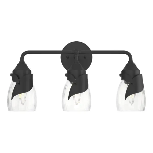 Stylized leaves, one small and one large, are handcrafted by Vermont artisans and envelop the bases of the Lapas' glass shades. Versatile in its design featuring curved metal arms, the Lapas 3-Light Bath Sconce can be positioned for up- or downlight.