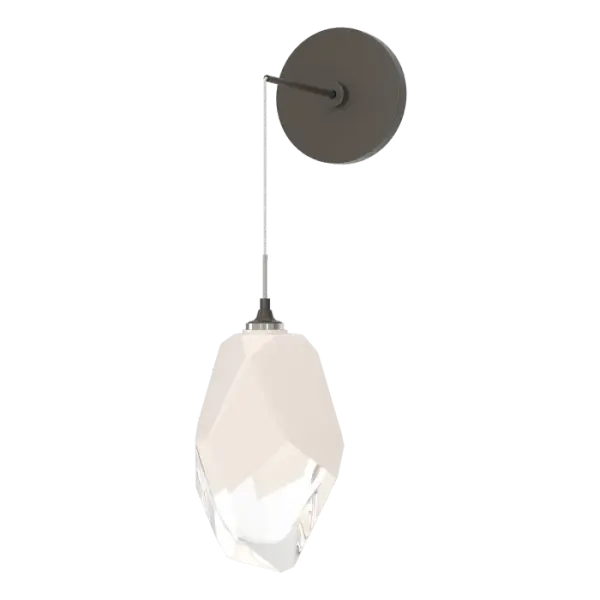 The Chrysalis Large Low Voltage Sconce features a large, handcrafted faceted glass crystal. You have the ability to set it at the drop height desired, creating unique opportunities for vanity, bedside and other applications. The Chrysalis’ trademark thick, clear layer of glass is encased in an outer layer of hand-blown, colored glass (matte black or white). Hand-polished like a gemstone, the lower portion of the outer layer of glass is removed to reveal the inner crystal clear layer below that is lit from within. - alternate view