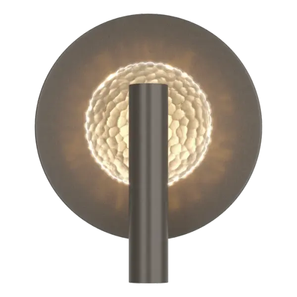 The beauty is in the details. The light is focused on a hand-poured, textured artisanal glass disc creating a unique glowing aura of light on its circular backplate.
