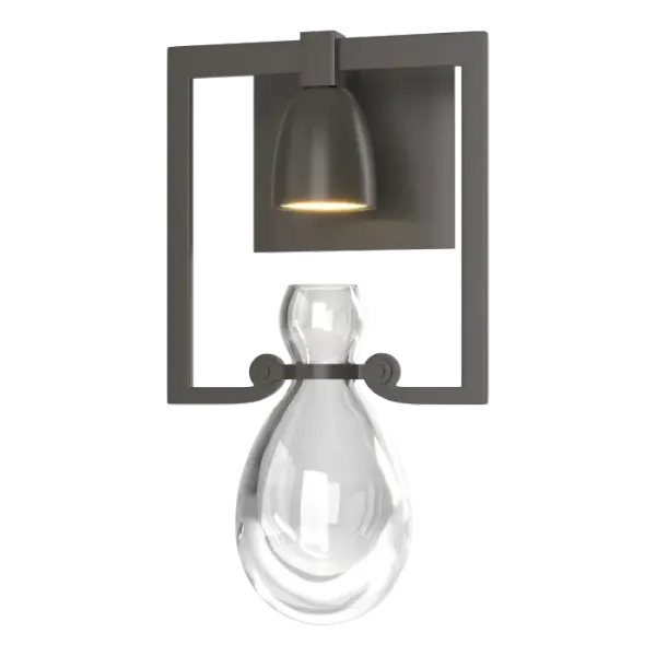 Pools of light trickle down and are captured within the Apothecary Sconce's thick hand-blown hourglass vessel. Simplicity and detail for well-balanced style. Part of the New Traditional Collection.