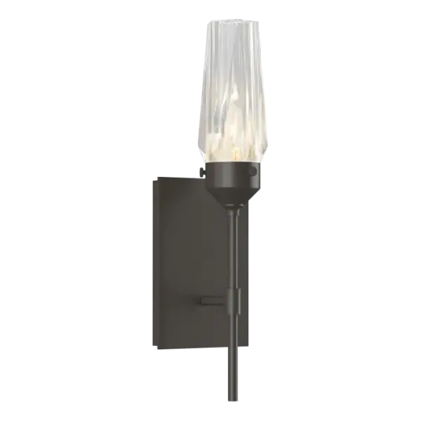 A thick, lustrous jewel of faceted crystal encases the light source within this dazzling wall sconce. The Luma Sconce is eye-catching opulence that offers a sophisticated beauty even when unlit.