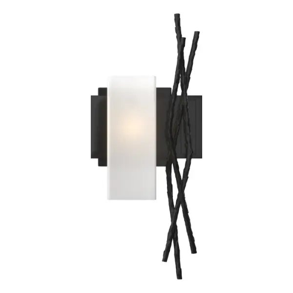 Sylvan meets steel with multi-faceted "twigs" forged from red-hot round bar stock hammered for texture and shape by our Vermont artisans. The steel sculpture couched beside the square glass tube offers an eye-catching accent.