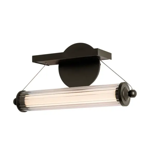 The 2021 Libra Collection includes the Libra LED Sconce that lends a perfect bit of industrial flair to suit a variety of spaces. The fluted glass tube is hung by low-voltage cables on either end allowing the end user to set it at a wide range of heights, whether it is placed over a mirror and bathroom vanity or in a theater room. Also available as a semi-flush, linear pendant and large square canopy version.