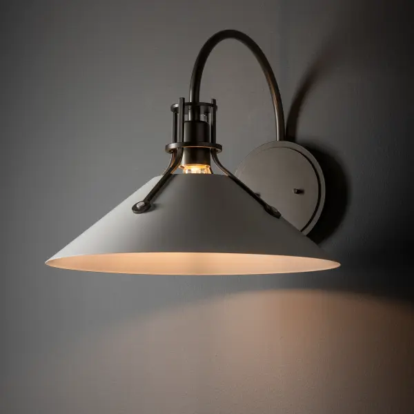 The iconic Henry Collection with its conical shades held by riveted metal arms adds a large indoor sconce to its offering. This Henry Large Sconce w/Metal Shade is available as a two-tone wall sconce with the option of a contrasting shade color. Available in all standard finishes. - alternate view