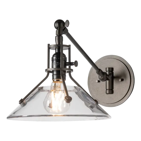 Not your average swing-arm wall sconce, this Henry also articulates vertically. A beautiful addition for interior spaces, the Henry Swing Arm Sconce w/Glass Shade features a shade made of thick, clear glass held by riveted metal arms.