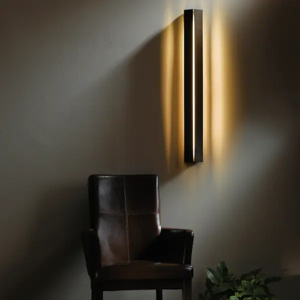This contemporary geometric and architectural Gallery Medium LED Sconce design is an update of an original design by HF's founder George Chandler. It features clean lines with a striking, central focal stripe of LED light, and a beautiful, soft light-wash on the sides.