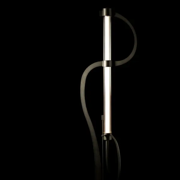The innovative Pulse Floor Lamp combines cutting-edge technology with elegant design. The conductive steel plates serve as pathways for electrons to pulse from one end of the LED tube to the other. Encased in clear ribbed glass, the frosted LED tube emits a soft and inviting glow. This vertical floor lamp's sleek shape brings style to any space. With its easy-to-use dimming feature, you can set the desired ambiance.