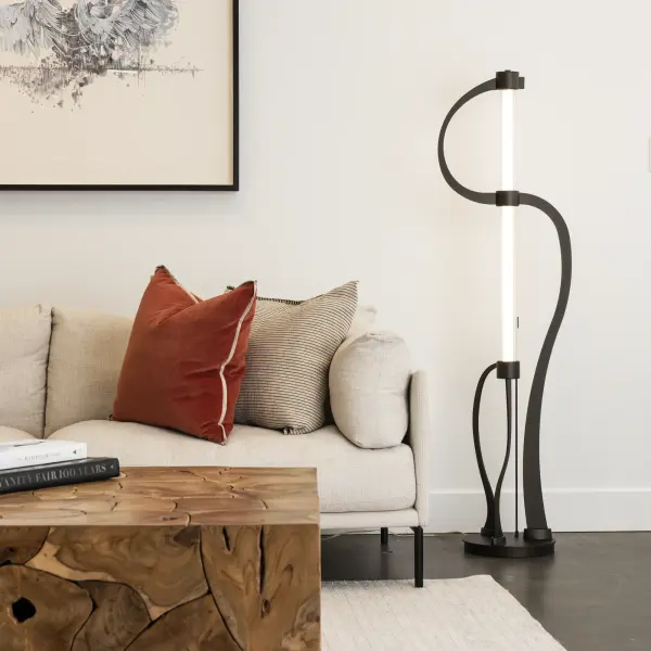 The innovative Pulse Floor Lamp combines cutting-edge technology with elegant design. The conductive steel plates serve as pathways for electrons to pulse from one end of the LED tube to the other. Encased in clear ribbed glass, the frosted LED tube emits a soft and inviting glow. This vertical floor lamp's sleek shape brings style to any space. With its easy-to-use dimming feature, you can set the desired ambiance. - alternate view