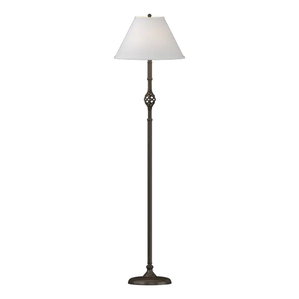 A traditional design with a literal twist, the modern blacksmiths here at Hubbardton Forge have crafted the famous twin basket design of yesteryear to adorn today's rooms. This floor lamp displays forging at its finest with the hand-worked steel basket.