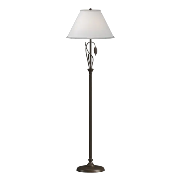 Our floor lamp is an example of "sylvan steel." Stems of iron sprout from the lamp post, with one gently curved stem culminating in a finely-crafted leaf. Shaped by artisans at our forge here in Vermont, each piece is unique.