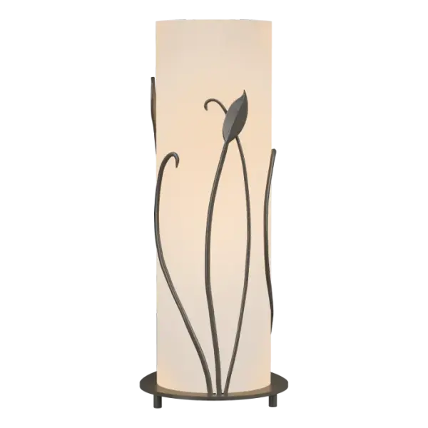 Hand-forged iron leaves and stems adorn the glass of this table lamp. The contrast between the metal and bright glass delivers a compelling visual. An on-off switch is located in the teardrop-shaped lamp base. Handcrafted by artisans at the Forge here in Vermont, each piece is unique.