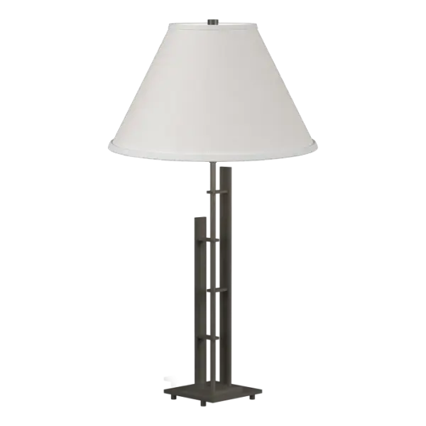 Strong, clean lines of hand-worked steel form the basis for our Metra Table Lamp. The clean, no-nonsense design fits well with most spaces. Crafted by artisans here in Vermont, each piece is unique.