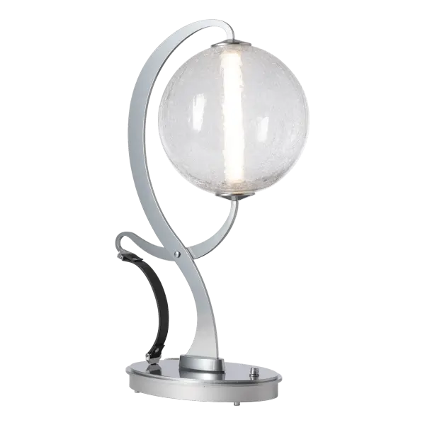 A contrast of vintage tongs with modern technology and luxury style are evident in the Pression Lamp. The stylized "tongs" grip the craqueled (or opal) glass globe at both ends, providing power to the LED to unique effect. The decorative leather strap completes the look for an unexpected textural element. A base dimmer enables you to go from task to relaxation with ease.