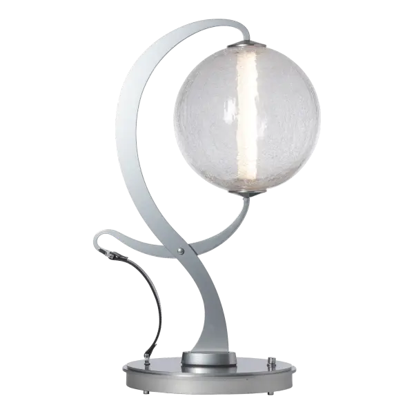 A contrast of vintage tongs with modern technology and luxury style are evident in the Pression Lamp. The stylized "tongs" grip the craqueled (or opal) glass globe at both ends, providing power to the LED to unique effect. The decorative leather strap completes the look for an unexpected textural element. A base dimmer enables you to go from task to relaxation with ease. - alternate view
