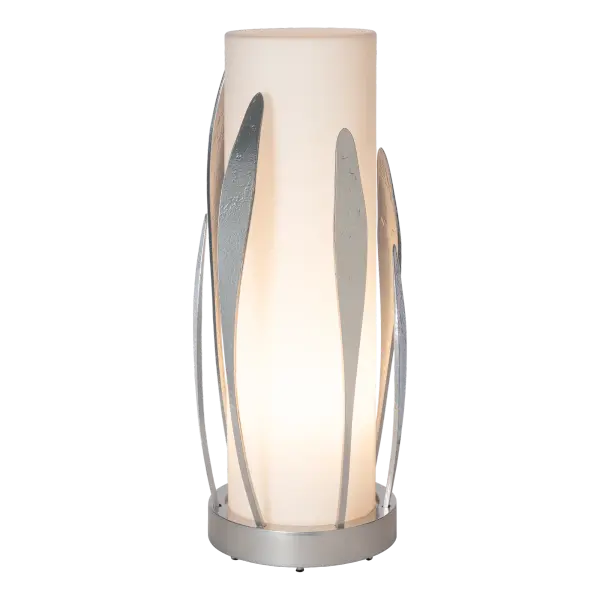 A vertical lamp with a small footprint, the Dahlia Cylindrical Table Lamp by HF designer Paul Marr Hilliard boasts a beautiful translucent frosted opal glass cylinder that shades the light within, surrounded by hand-forged "petals" made by Vermont artisans. - alternate view