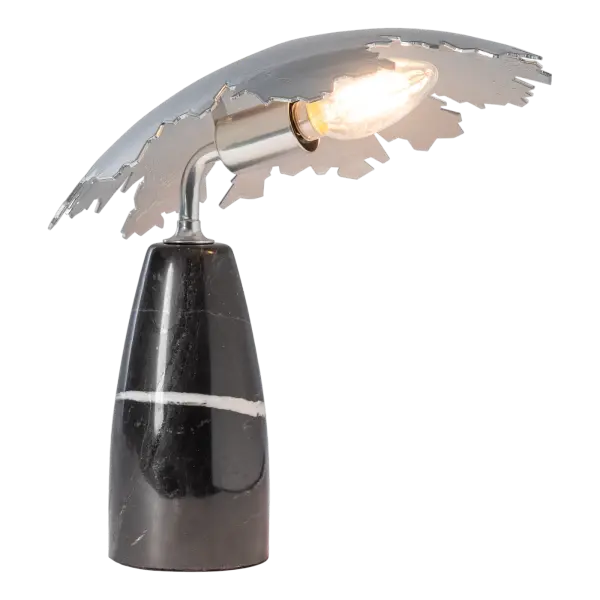 A uniquely shaped small vertical base is offered in an exclusive natural lilac or black marble to ground the Pangea Mini Table Lamp. Designed by HF's David Martin with a handcrafted steel "shield" creating a downwardly directed light and convenient cord switch, this lamp is a versatile task or accent lamp.