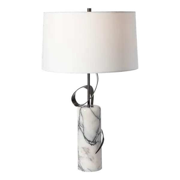 Artistry and nature intertwine seamlessly in the Rivulet Table Lamp. Inspired by the grace of a gentle Vermont stream making its way through a stony bed, the Rivulet showcases a combination of steel and hand-selected lilac marble quarried in Turkey. Each piece is a white marble with purple veins, boasting captivating color variations, making it a true work of art that brings the tranquil beauty of nature into any space.