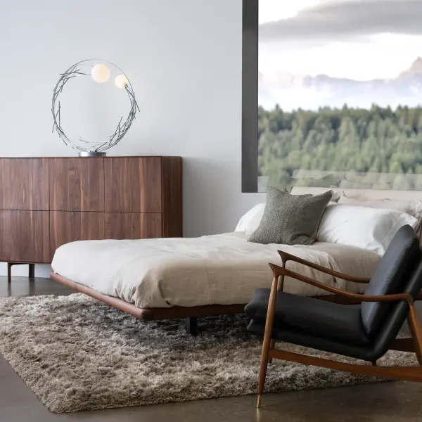 The Brindille Ring Lamp's nature-inspired artistry is reminiscent of Patrick Dougherty’s stickwork seen in nearby Middlebury VT. Each steel twig is hand-crafted and hammered creating the Brindille’s circular ring. It can be placed on a console table, floor area, or in a large wall alcove, or more. The Brindille’s unique glass globes feature a mottled, monochrome tortoiseshell pattern in white, adding an element of elegance and intrigue to its surroundings.