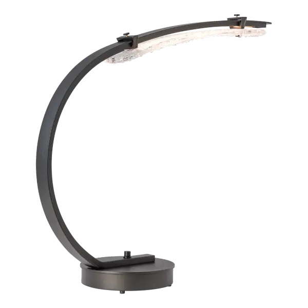 Inspiration for the Glissade struck designer Andy Morter as he was walking across an icy midwestern pond. “ were unlike anything else I’d seen in nature. There’s something raw and beautiful in that contrast—sharp yet serene, delicate yet strong.” With its gracefully curved steel arm and base dimmer, this table lamp does double work as both a decorative and task light. - alternate view