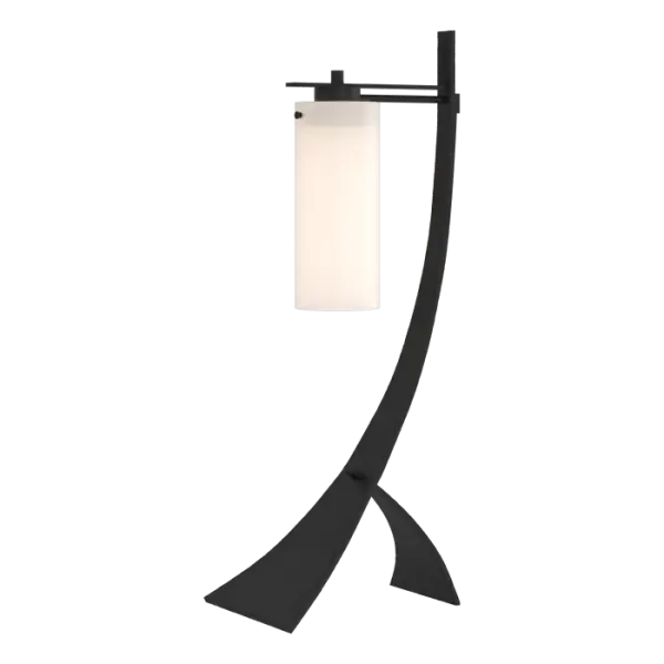 The "Stasis" of our table lamp could just as easily reference what happens to people who see it up close for the first time - they stop as they consider the graceful balancing act performed by iron hand-forged into gentle curves and counterbalanced by elegant glass.