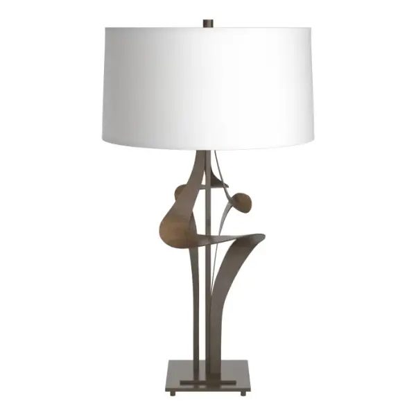Our Vermont artisans have created a visual illusion. Does the hand-forged steel of the Antasia Table Lamp look like liquid flowing down from the shade, or does it look like smoke rising up into it? Opinions may vary but there is a consensus about the artistry on display.
