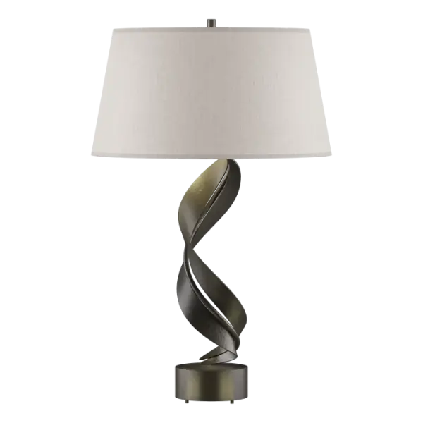 Ribbons of hand-forged steel dance around each other and the pipe and rise up from the base of this table lamp on their journey to the stylish shade. Handcrafted by artisans here at our forge in Vermont, each piece is unique.