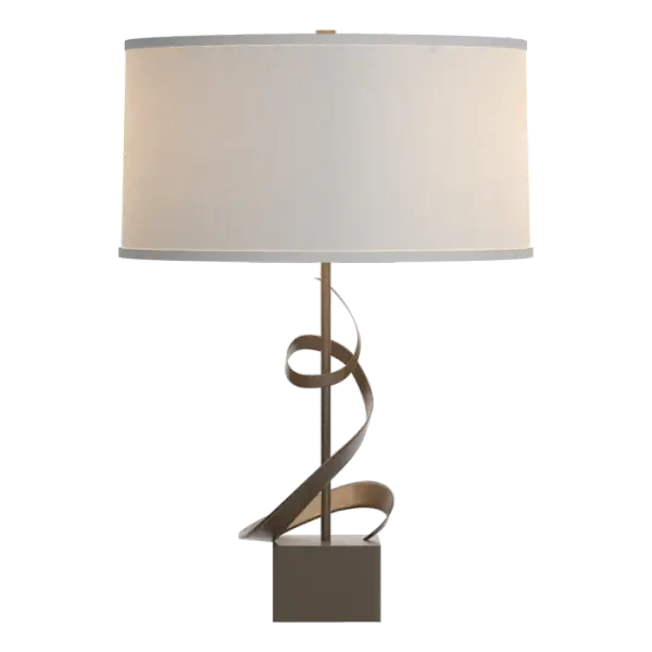 A work of art in its own right, our Gallery Table Lamp exhibits three twists of forged steel that flows from pedestal to shade, wrapping around the lamp tube along the way. Crafted by our metal virtuosos at our forge here in Vermont, each piece is unique.
