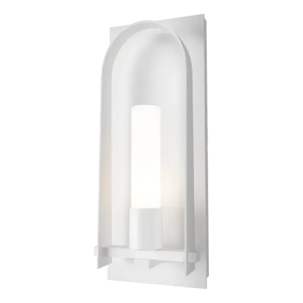 A classically arched shape and details that reference craftsman tenons, at over 27” tall, the Triomphe Large Outdoor Sconce designed by HF’s David Martin features a substantial sleek clear seeded or opal cylinder glass shade with a graceful, handmade arch on an aluminum backplate, and any of our robust AAMA-rated Coastal Outdoor Finishes.