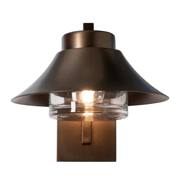 Perfectly scaled for smaller exterior spaces, the Stowe Small Outdoor Sconce brings understated character and purposeful performance to barns, cottages, and refined residential exteriors alike. Its signature hood directs illumination downward, improving visibility where it matters most. Constructed from durable aluminum and finished in any of our Coastal Outdoor Finishes, the small Stowe sconce provides reliable accent and pathway lighting. Two Marine Grade options are also available for demanding coastal environments (small upcharge applies), offering added protection against the elements. - alternate view