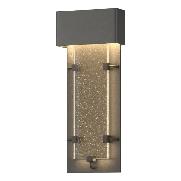 The Ursa features a thick panel of seeded glass that glows like its constellation namesake. The LED source is concealed behind the top metal enclosure, allowing the light to stream through the vertical glass panel below. It looks amazing indoors too.