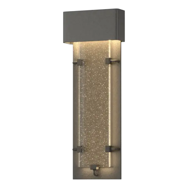 The Ursa features a thick panel of seeded glass that glows like its constellation namesake. The LED source is concealed behind the top metal enclosure, allowing the light to stream through its large vertical glass panel below. It looks amazing indoors too.