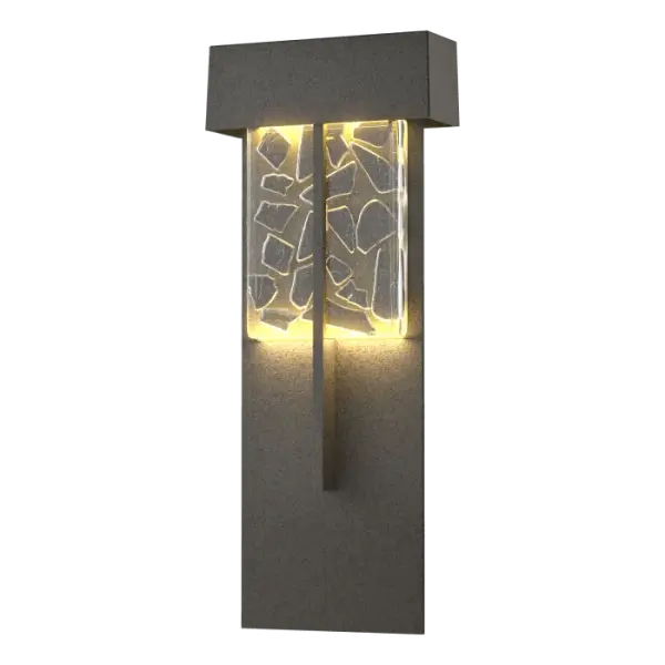 The acclaimed Shard Outdoor Collection welcome a new additional, the Shard XL. Made of aluminum and crafted for the outdoors, it is beautiful enough to illuminate indoors, as well. With shards of grey glass embedded in a clear block of hand-poured artisanal glass made in Vermont by local glassmakers, the Shard's light reflects and refracts. Also available in Large and Small versions.