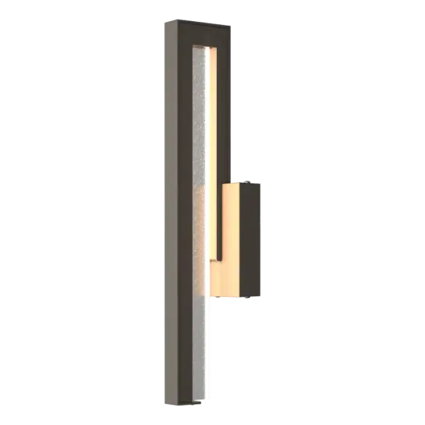 Accentuating the beauty of fundamental geometric shapes, the Edge is contemporary and decidedly influenced by architectural form. This medium sconce features seeded glass for added sparkle.