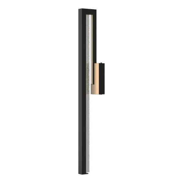 Accentuating the beauty of fundamental geometric shapes, the Edge is contemporary and decidedly influenced by architectural form. This large sconce features seeded glass for added sparkle.