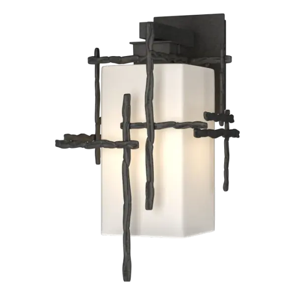 A mid-sized fixture for exterior walls, the Tura Medium Outdoor Sconce is available in any of our robust Coastal Outdoor Finishes. Hammered annealed aluminum "twigs" are made by hand in Vermont and embellish the opal shade held by a short aluminum arm and plate from above.