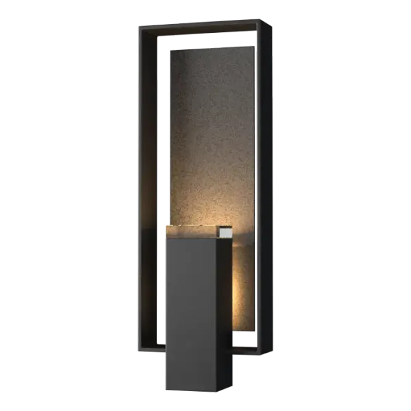 By focusing on materials and faultless geometric balance, the Shadow Box sconce proves that high-impact lighting need not be complex. Layers of diffused light and dramatic shadow create the perfect blend of style and austere lines. Each piece is accented with a block of optic crystal for an added touch of elegance. Custom accent plate available.